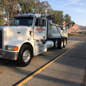 NPG Asphalt - a large white dump truck parked on the side of the road - General Contractors Near Me - Perris, California NPG Asphalt - a large white dump truck parked on the side of the road - General Contractors Near Me - Perris, California
