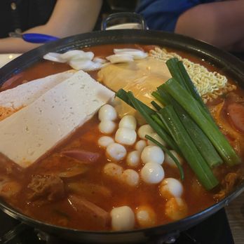 Bay Pocha - Army Stew - Spicy Pork, Kimchi, Spam, Sausage, Vegetables, and Ramen Noodles in a Hot, Spicy Broth - Korean Near Me - San Francisco, California Bay Pocha - Army Stew - Spicy Pork, Kimchi, Spam, Sausage, Vegetables, and Ramen Noodles in a Hot, Spicy Broth - Korean Near Me - San Francisco, California