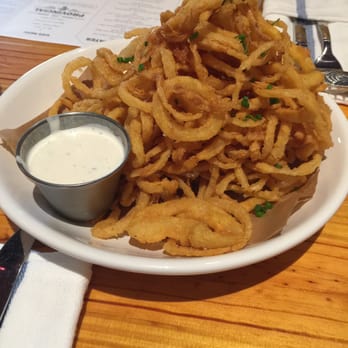 The Provincial - Corn flour dusted shoestring onion rings with cucumber ranch - New American Near Me - Apex, North Carolina The Provincial - Corn flour dusted shoestring onion rings with cucumber ranch - New American Near Me - Apex, North Carolina
