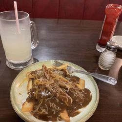 Frazier's Restaurant - Hamburger patty topped with steak fries, gravy, and cheese