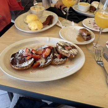 The Toasted Yolk Cafe - Croissant French toast w/ macerated strawberries - Breakfast & Brunch Near Me - Lafayette, Louisiana The Toasted Yolk Cafe - Croissant French toast w/ macerated strawberries - Breakfast & Brunch Near Me - Lafayette, Louisiana