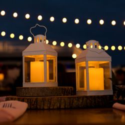 The Black Barn Event Planning - Lanterns under string lights and night sky