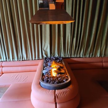 High Noon - a fire pit in the middle of a living room - Beer Bar Near Me - Austin, Texas High Noon - a fire pit in the middle of a living room - Beer Bar Near Me - Austin, Texas