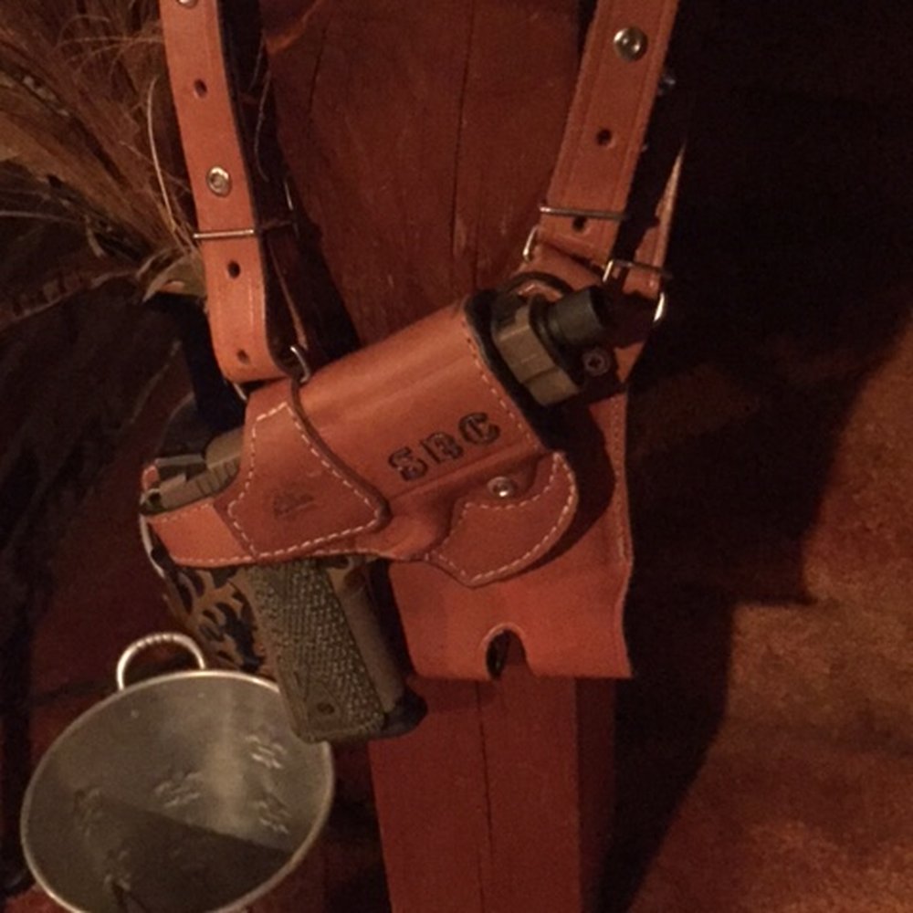 My .45 ACP shoulder rig hanging on the newel post.