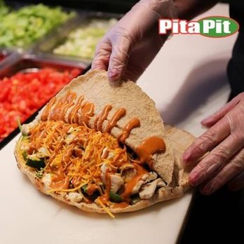 Pita Pit Spring Garden - a person making a pita sandwich - Sandwiches Near Me - Halifax, Nova Scotia Pita Pit Spring Garden - a person making a pita sandwich - Sandwiches Near Me - Halifax, Nova Scotia