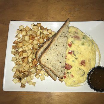 Dime Store - Veggie Omelette with goat cheese, potatoes, whole grain toast, and their house made peach jam - Breakfast & Brunch Near Me - Detroit, Michigan Dime Store - Veggie Omelette with goat cheese, potatoes, whole grain toast, and their house made peach jam - Breakfast & Brunch Near Me - Detroit, Michigan