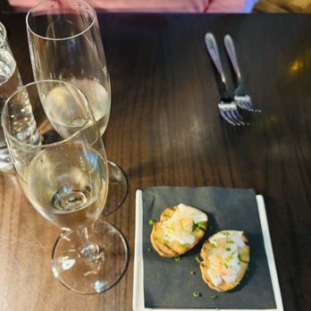 Posana - Amuse bouche of shrimp toasts with complementary champagne - New American Near Me - Asheville, North Carolina Posana - Amuse bouche of shrimp toasts with complementary champagne - New American Near Me - Asheville, North Carolina