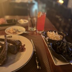 Oak Steakhouse - Delicious food...Lambchops, Braised Collard Greens & Mashed Potatoes