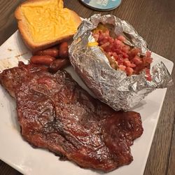 The Steak - Steak, cheese toast, bake tater, and cocktail winnies