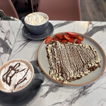 Kaffeinated Crepes and Coffee - White chocolate mocha, Nutella Caliente / Hot Nutella, Crepa de Triple Chocolate / Triple Chocolate Crepe - Coffee & Tea Near Me - San Antonio, Texas Kaffeinated Crepes and Coffee - White chocolate mocha, Nutella Caliente / Hot Nutella, Crepa de Triple Chocolate / Triple Chocolate Crepe - Coffee & Tea Near Me - San Antonio, Texas