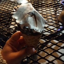 Fudge brownie custard in chocolate dipped waffle cone Fudge brownie custard in chocolate dipped waffle cone