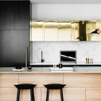 Great Canadian Kitchen - Bright Brass Sheet Metal Cabinets Complete with Black Laminated Millwork and Staging Details. - Cabinetry Near Me - Toronto, Ontario Great Canadian Kitchen - Bright Brass Sheet Metal Cabinets Complete with Black Laminated Millwork and Staging Details. - Cabinetry Near Me - Toronto, Ontario