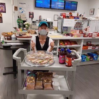 The Cozy Deli - Sonia (owner of Cozy Deli) and a catering sandwich tray - Delis Near Me - Bethesda, Maryland The Cozy Deli - Sonia (owner of Cozy Deli) and a catering sandwich tray - Delis Near Me - Bethesda, Maryland