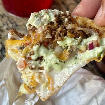 Brass Balls Saloon - 2024 | $12.99 | Super Nachos - now topped with a drizzle of cilantro crema, taking an already incredible appetizer to new heights. - Bars Near Me - Ocean City, Maryland