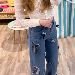 Endless Waves Boutique - Sloane styling her new LoveShackFancy bow sweater with even more bows.
