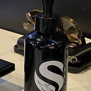 BLK SWAN - Hand sanitizer on table - New American Near Me - Baltimore, Maryland