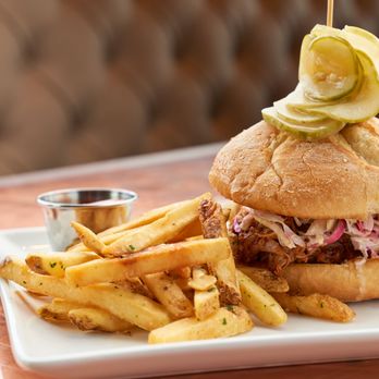 Secret Sauce - a pulled pork sandwich with french fries - Southern Near Me Secret Sauce - a pulled pork sandwich with french fries - Southern Near Me