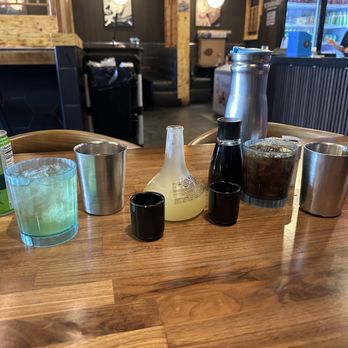 Yoshiharu Ramen - From left to right: Green tea, Aladdain Yuzu sake, Coca Cola. Also gives the table water - Ramen Near Me - Las Vegas, Nevada