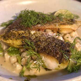 Manuela - Sea Bass with fava beans, hominy, St. Felicien butter, cilantro, key lime - New American Near Me - Los Angeles, California Manuela - Sea Bass with fava beans, hominy, St. Felicien butter, cilantro, key lime - New American Near Me - Los Angeles, California