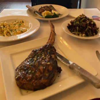 Mamma Mia - Tomahawk steak, lobster ravioli, pork chop, salad (From bottom clockwise) - Italian Near Me - Bakersfield, California Mamma Mia - Tomahawk steak, lobster ravioli, pork chop, salad (From bottom clockwise) - Italian Near Me - Bakersfield, California