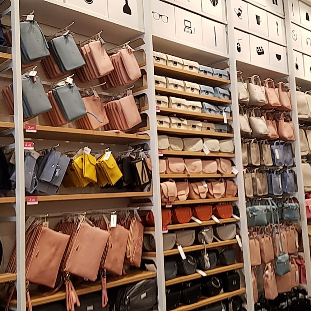 Miniso - Rows of discount handbags. - Accessories Near Me - Los Angeles, California Miniso - Rows of discount handbags. - Accessories Near Me - Los Angeles, California