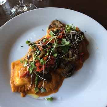 Cantinetta Bellevue - Vegetarian cheese ravioli with tomato sauce, morels and asparagus. Good! Order a salad and bread too because it's not the most filling dish. - Italian Near Me - Bellevue, Washington