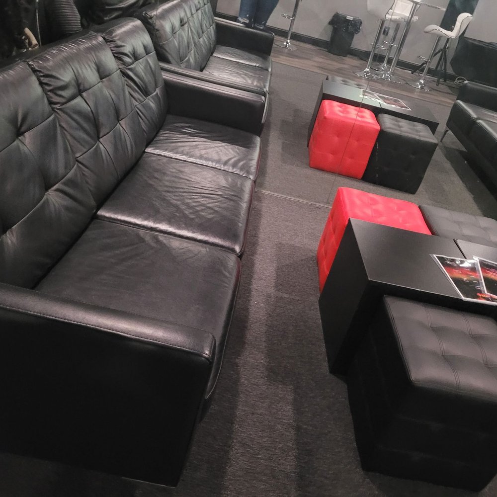 Blazen Hookah Lounge - a black leather sofa and ottoman - Hookah Bars Near Me - Middle River, Maryland