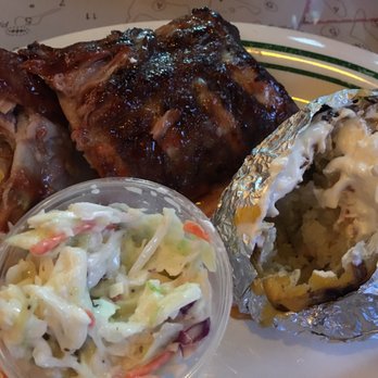 Flanigan's - Doral - Ugh why do I always start eating before I take a pic? Half rack with loaded baked potato & cole slaw. - Bars Near Me - Doral, Florida