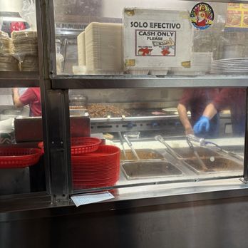 El Farolito - Mounds of meat being cooked - Mexican Near Me - San Francisco, California