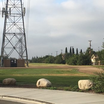 Riverview Park - The Edison towers are among the careful laid out grounds, some have cell tower sites on top. - Dog Parks Near Me - Bellflower, California Riverview Park - The Edison towers are among the careful laid out grounds, some have cell tower sites on top. - Dog Parks Near Me - Bellflower, California