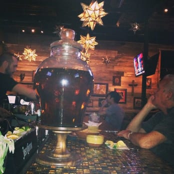 Pistolero's - The bar showcasing the infused tequilas. - Mexican Near Me - Houston, Texas Pistolero's - The bar showcasing the infused tequilas. - Mexican Near Me - Houston, Texas