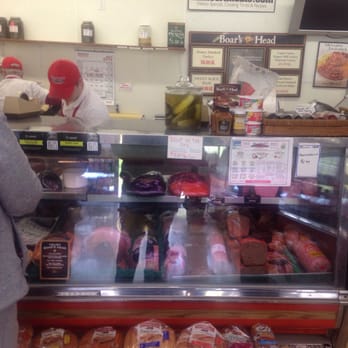 Humbert Meats - a man and a woman in a store - Meat Shops Near Me - Cincinnati, Ohio