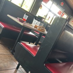 Pizza Inn - One of the many tables that had dirty dishes plied up on them.