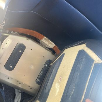 Spirit Airlines - My seat was completely torn from the base before the flight. But flight attendant said it's ok. In what world is it ok? - Airlines Near Me - Seattle, Washington