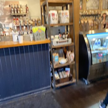 Sweetea's Tea Shop - a blurry image of a woman walking past a counter - Coffee & Tea Near Me - Nashville, Indiana Sweetea's Tea Shop - a blurry image of a woman walking past a counter - Coffee & Tea Near Me - Nashville, Indiana