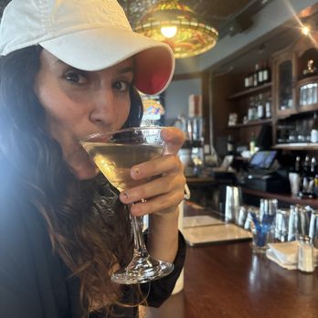Moss Beach Distillery - Hanna enjoying her dirty gin martini - Seafood Near Me - Moss Beach, California Moss Beach Distillery - Hanna enjoying her dirty gin martini - Seafood Near Me - Moss Beach, California