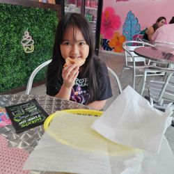 Tati's Cakes & Coffee Shop - Daughter enjoying the donuts