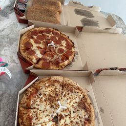 Cheese and Pep pizza with breadsticks