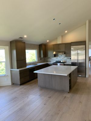 Kitchen remodel 2025 - This remodel was done earlier this year . The kitchen was outdated and needed a fresh look . We removed the old kitchen down to the studs and installed new flooring , enlarged the island installed new cabinets, countertops and appliances .
