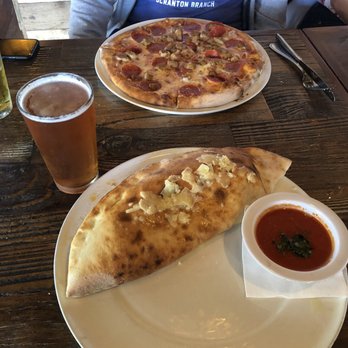 Cicciotti's - Pepperoni and sausage calzone with Latitude 33 blood orange IPA great combo - Italian Near Me - Carlsbad, California Cicciotti's - Pepperoni and sausage calzone with Latitude 33 blood orange IPA great combo - Italian Near Me - Carlsbad, California