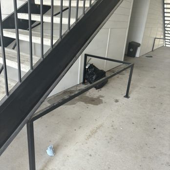 Remi Apartment Homes - Trash that has been sitting under the stairs for days now attracting more bugs because vallet trash service doesn't come daily - Apartments Near Me - White Settlement, Texas