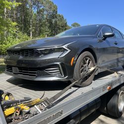 Bibi Towing - Vehicle loaded and strapped onto flat bed truck