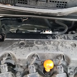 Auto Plus Automotive Service - Oil splashed everywhere without the fill cap. Causing the check engine light to come on and oil fume smell within the car