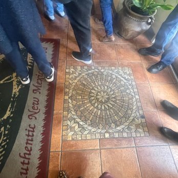 El Charritos - a group of people standing in a circle - New Mexican Cuisine Near Me - Albuquerque, New Mexico