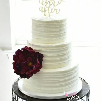 Pink Icing - a wedding cake with a flower on top - Custom Cakes Near Me Pink Icing - a wedding cake with a flower on top - Custom Cakes Near Me