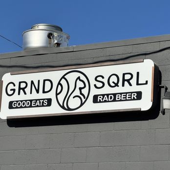 Grnd Sqrl - Signage on back of building where there is a parking lot with plenty of free parking. - Gastropubs Near Me - Twentynine Palms, California