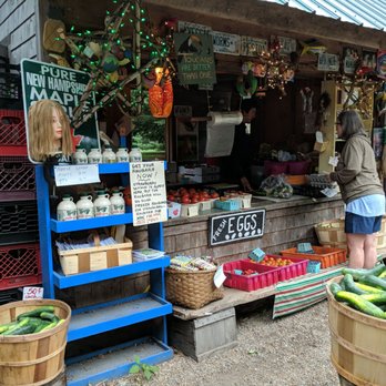 Owens Truck Farm - a woman standing in front of a produce stand - Farmers Market Near Me - Ashland, New Hampshire Owens Truck Farm - a woman standing in front of a produce stand - Farmers Market Near Me - Ashland, New Hampshire