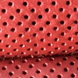 Garry's Auto Upholstery - Close up of the ventilated leather. It appears the holes were not fully coated/dyed/painted? Leading to that haze appearance.