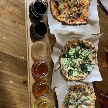 Warrior Brewing Company - three different pizzas on a table - Breweries Near Me - Duluth, Minnesota