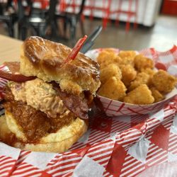 Hattie B's Hot Chicken - Franklin - Factory - Breakfast biscuit. Pimento cheese, bacon, egg and medium spice. Add some tater tots for fun!